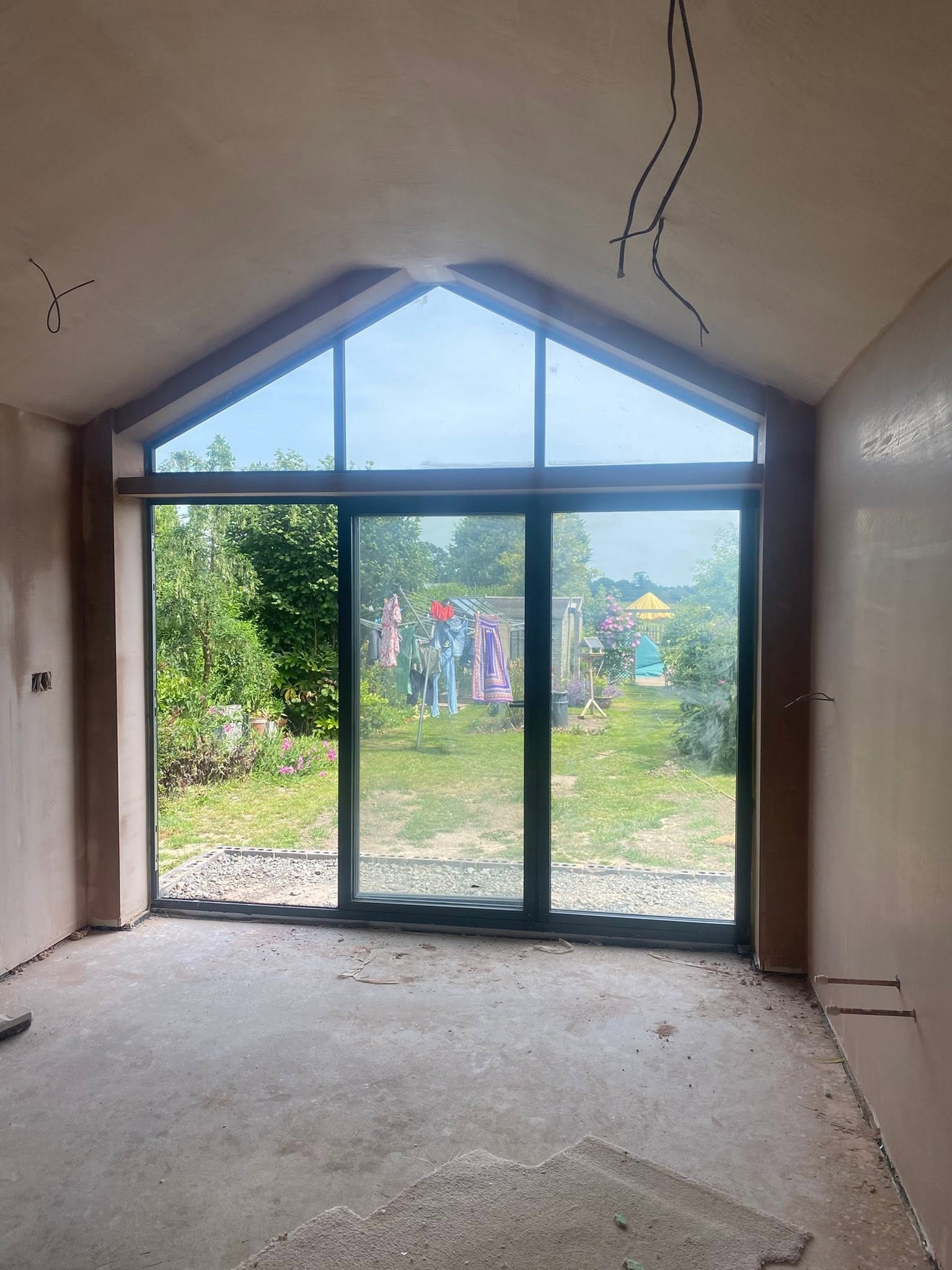 New extension in Saint Martins with a vaulted ceiling and full-height glazed gable, freshly plastered